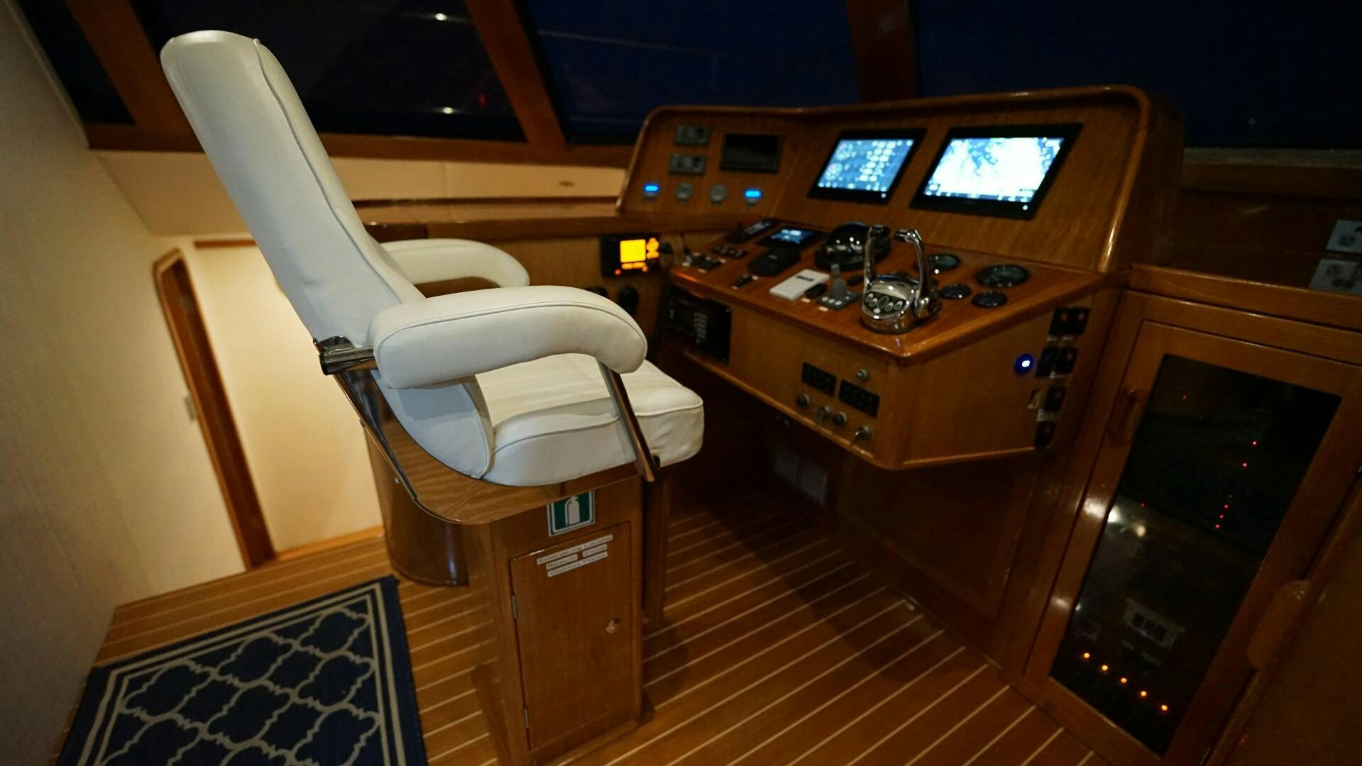 a room with a chair and a desk with a computer on it aboard SOVEREIGN Yacht for Sale