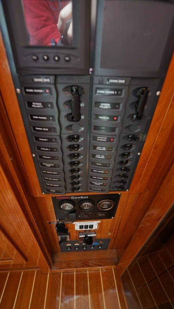 a tv on a cabinet aboard SOVEREIGN Yacht for Sale