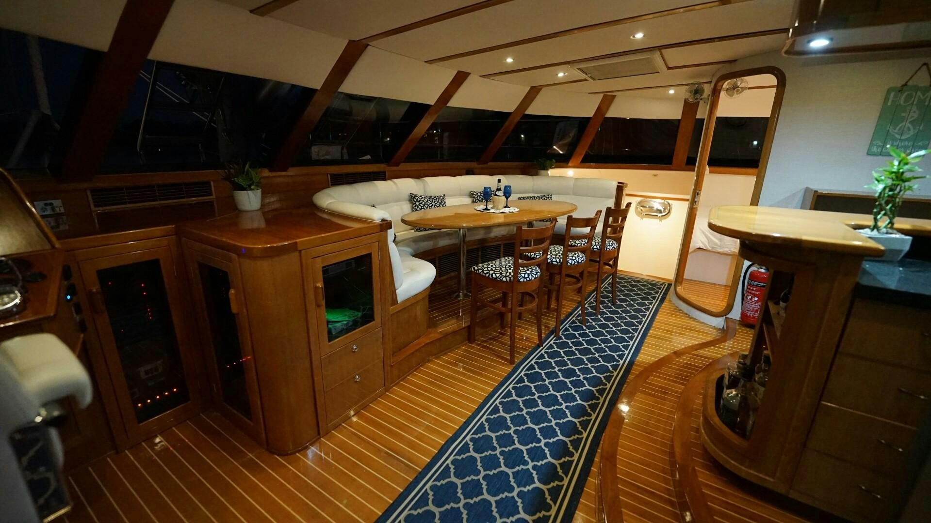 a room with a desk and chairs aboard SOVEREIGN Yacht for Sale