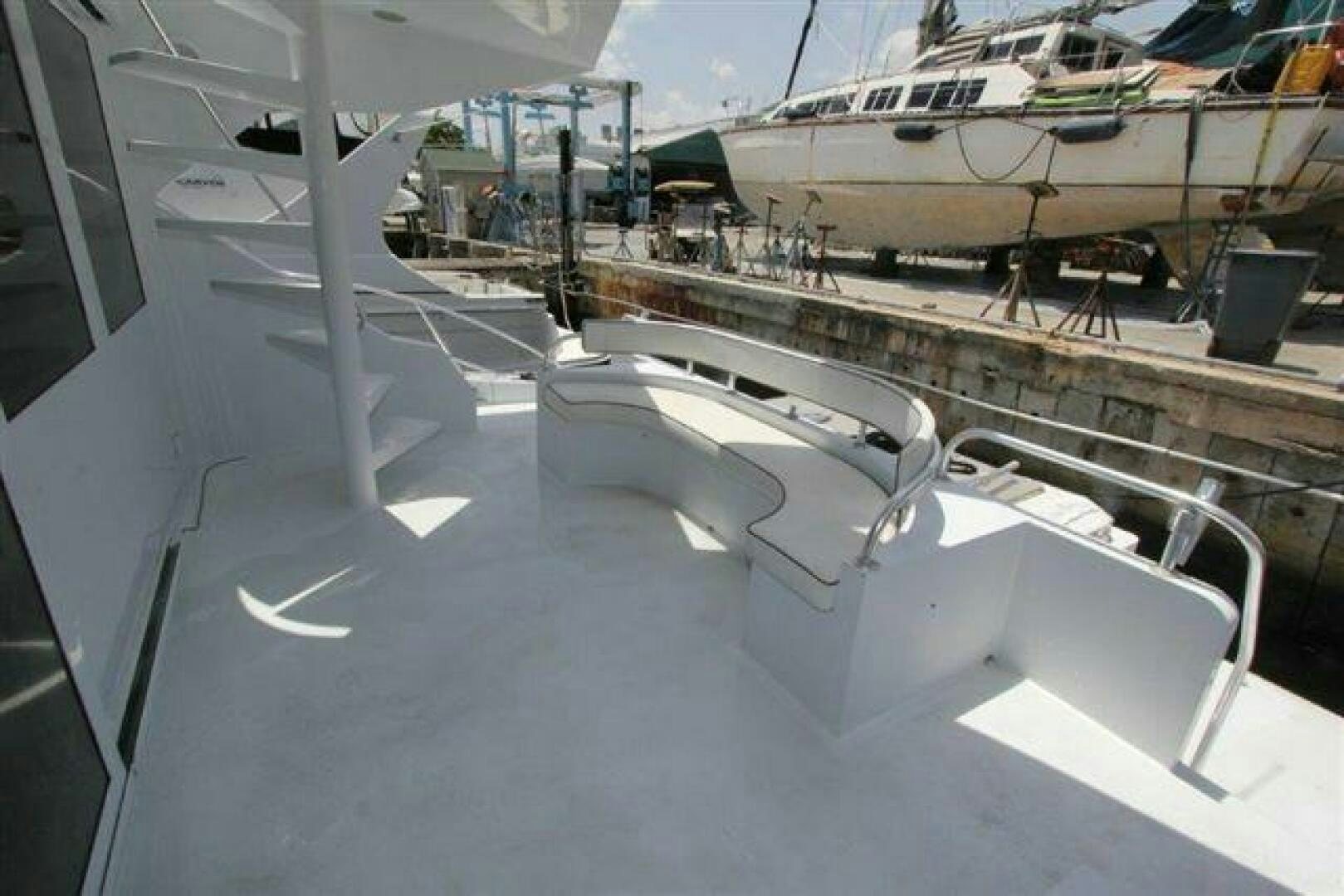 a plane wing with a plane in the background aboard PRICELESS Yacht for Sale