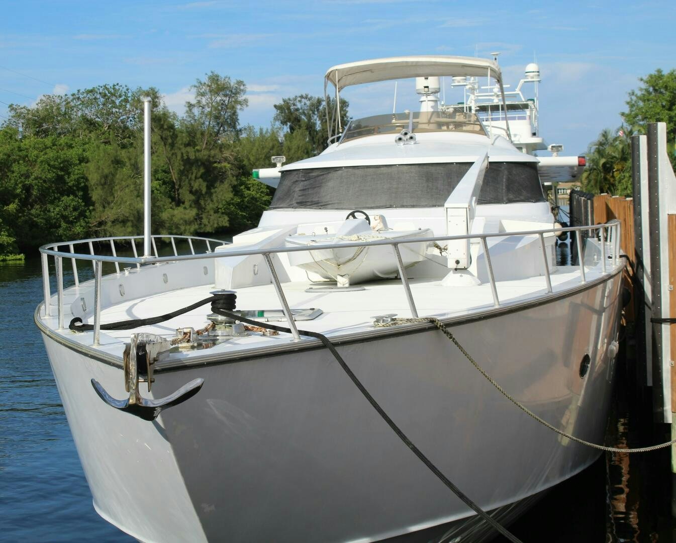 a white boat docked aboard PRICELESS Yacht for Sale