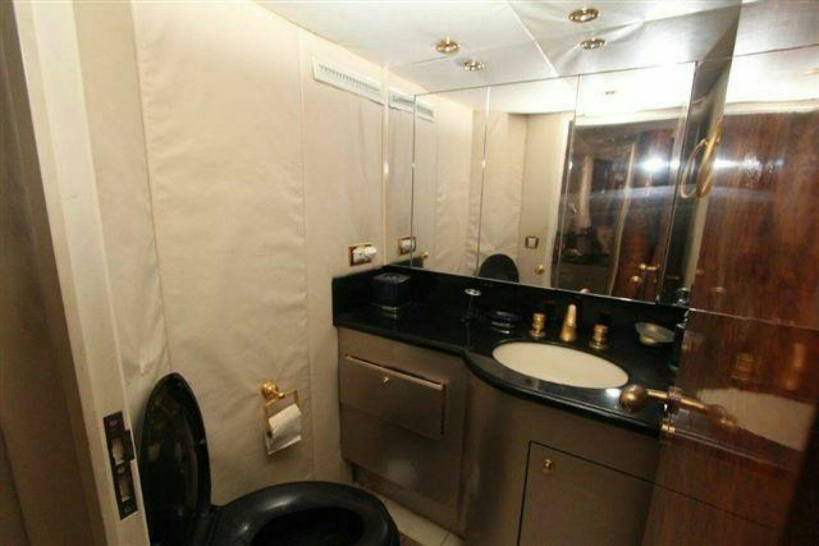 a bathroom with a sink and a mirror aboard PRICELESS Yacht for Sale