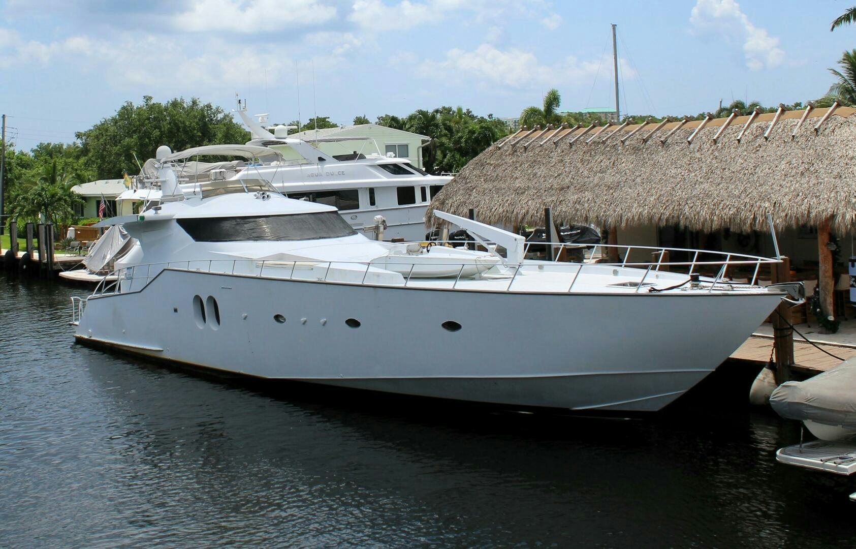 a boat docked at a pier aboard PRICELESS Yacht for Sale