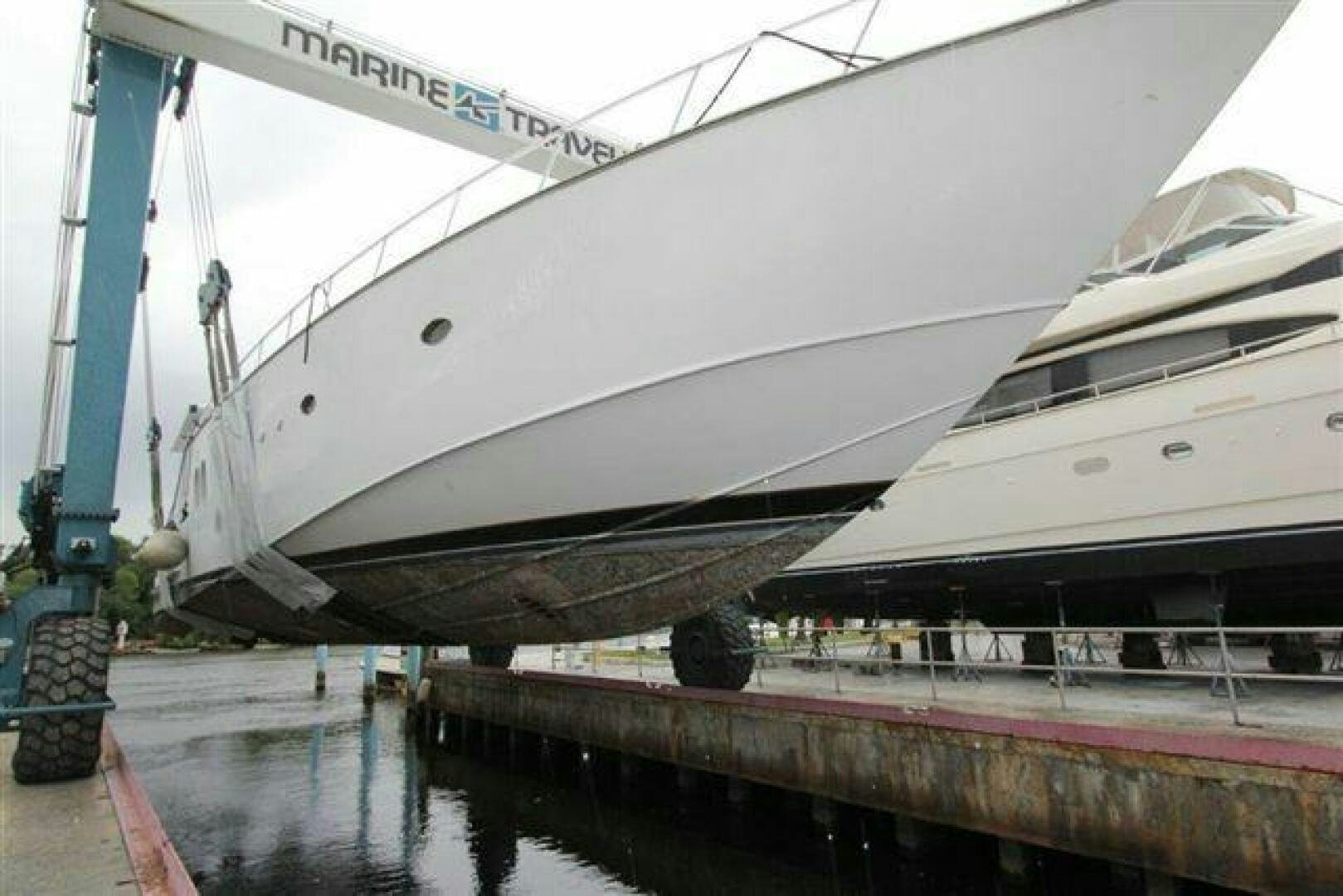 a large white boat docked aboard PRICELESS Yacht for Sale