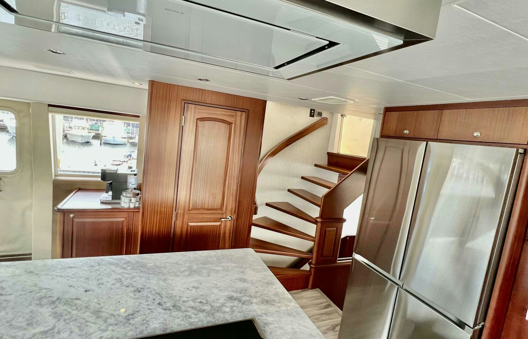 a room with a bed and a desk aboard LADY B Yacht for Sale