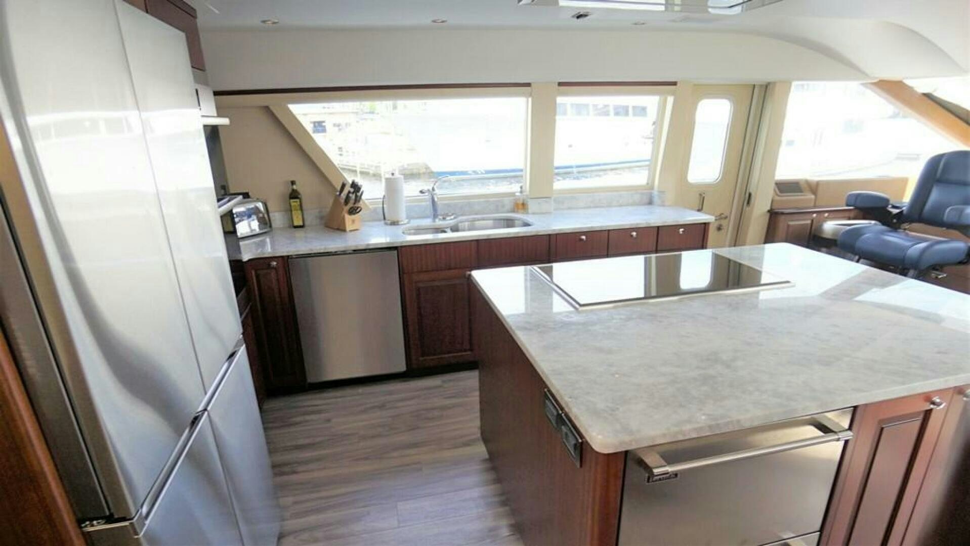 a kitchen with a large island aboard LADY B Yacht for Sale