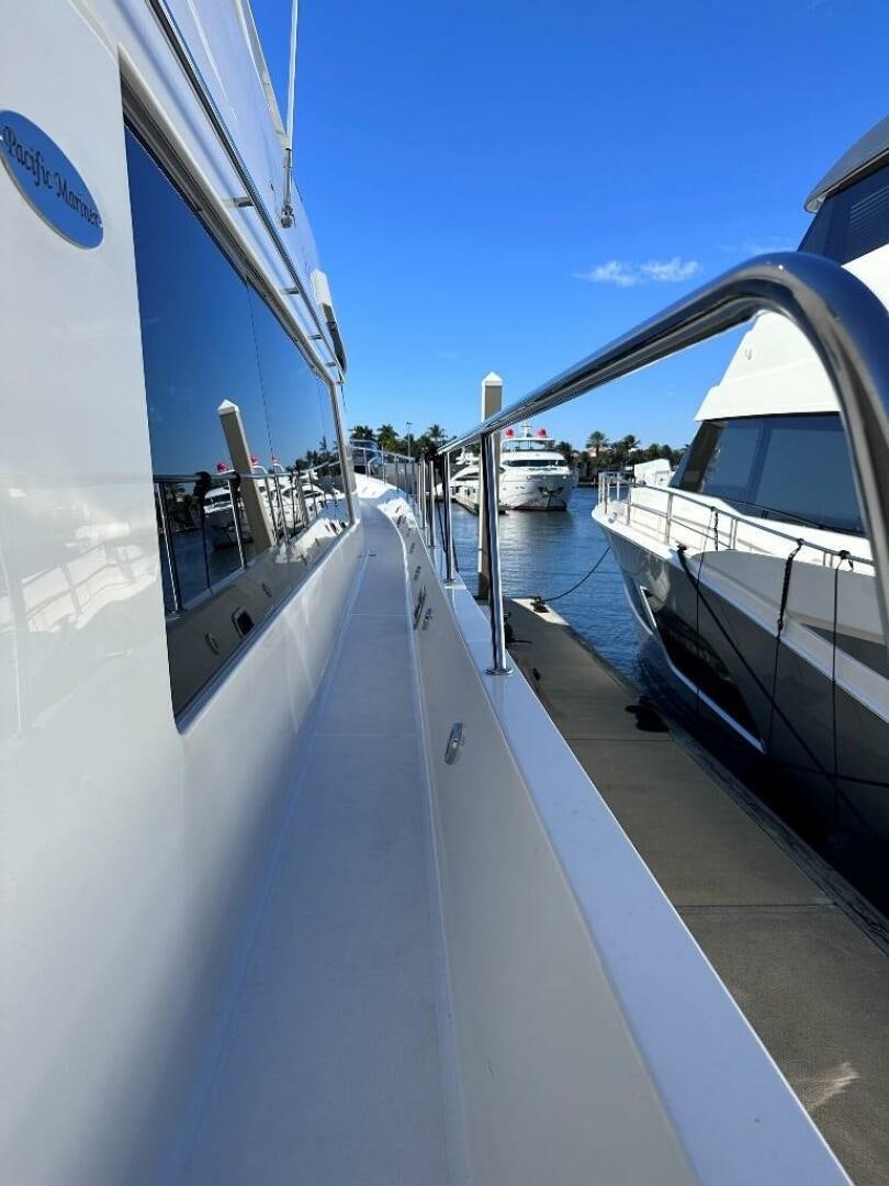 a boat is parked on the side of the water aboard LADY B Yacht for Sale