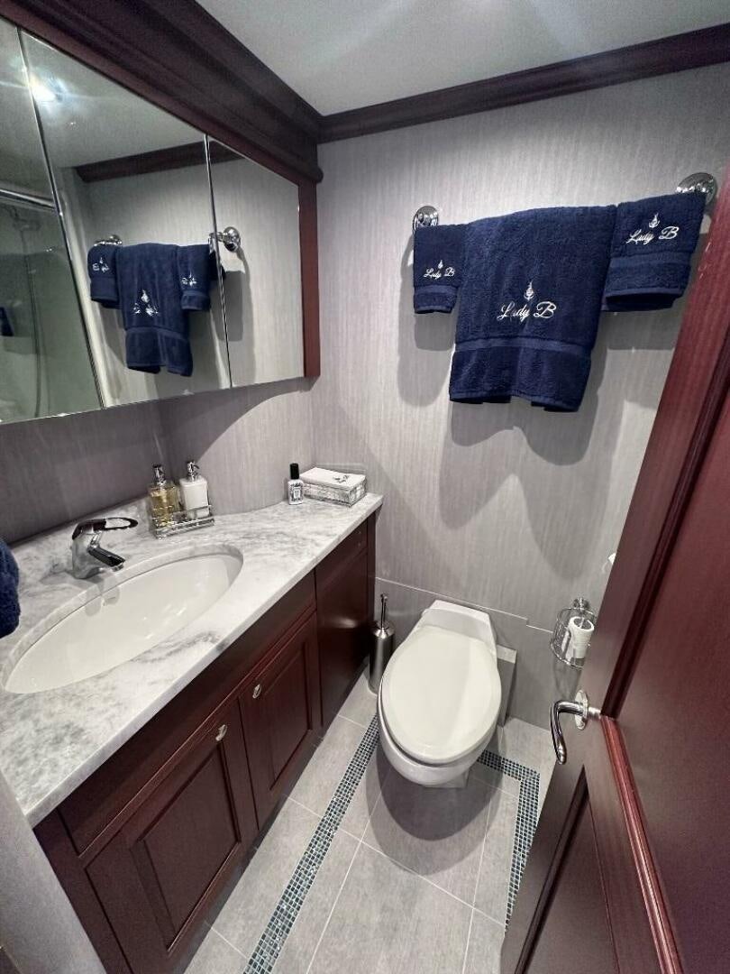 a bathroom with a toilet and sink aboard LADY B Yacht for Sale