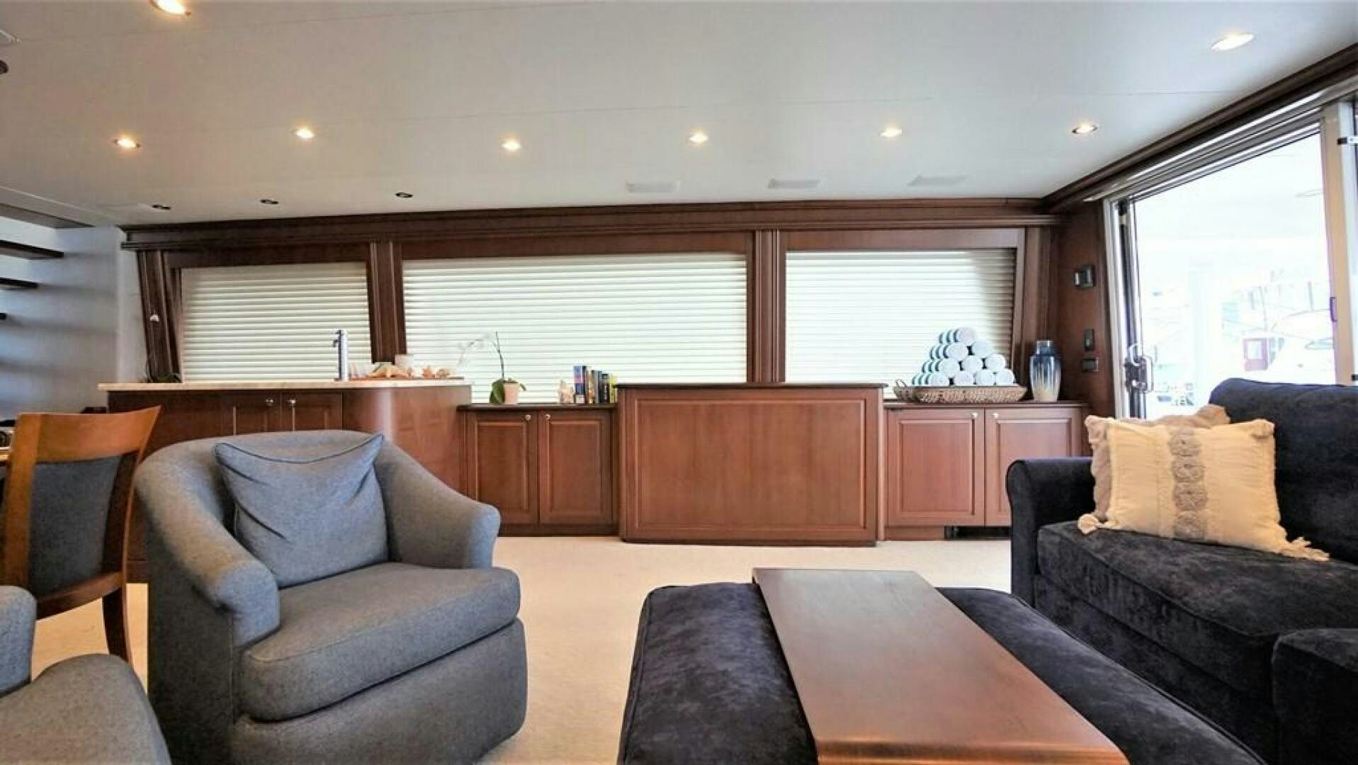 a living room with a couch and a coffee table aboard LADY B Yacht for Sale