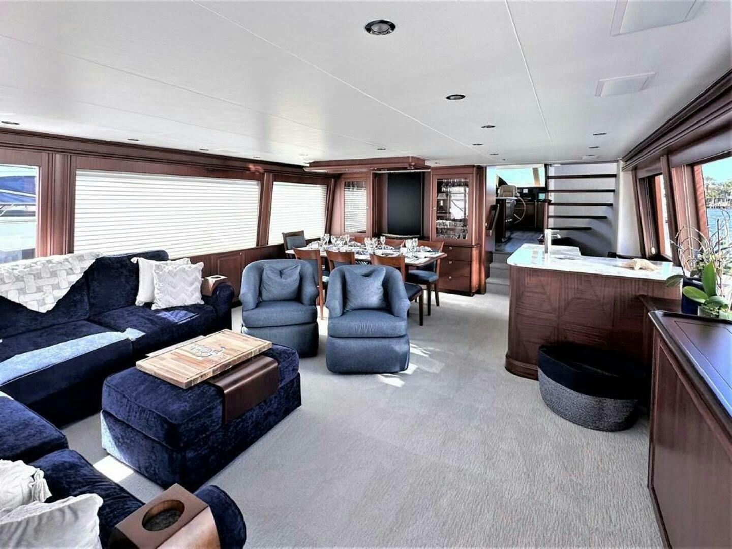 a living room with a couch and a television aboard LADY B Yacht for Sale