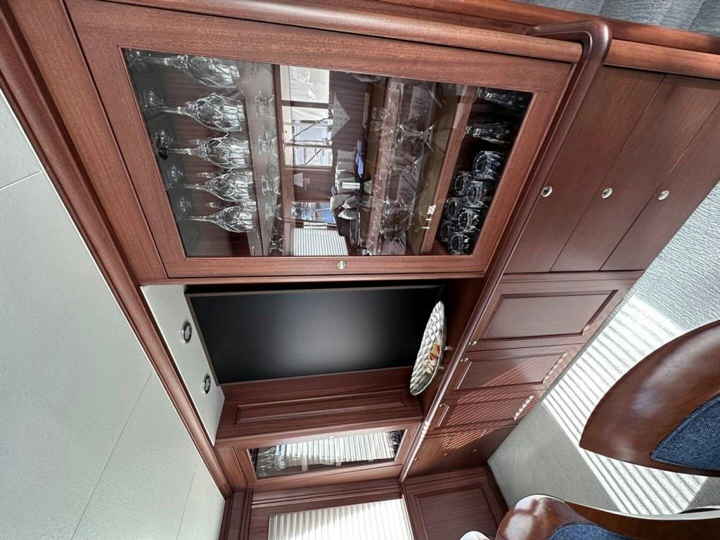 a tv on a wooden shelf aboard LADY B Yacht for Sale