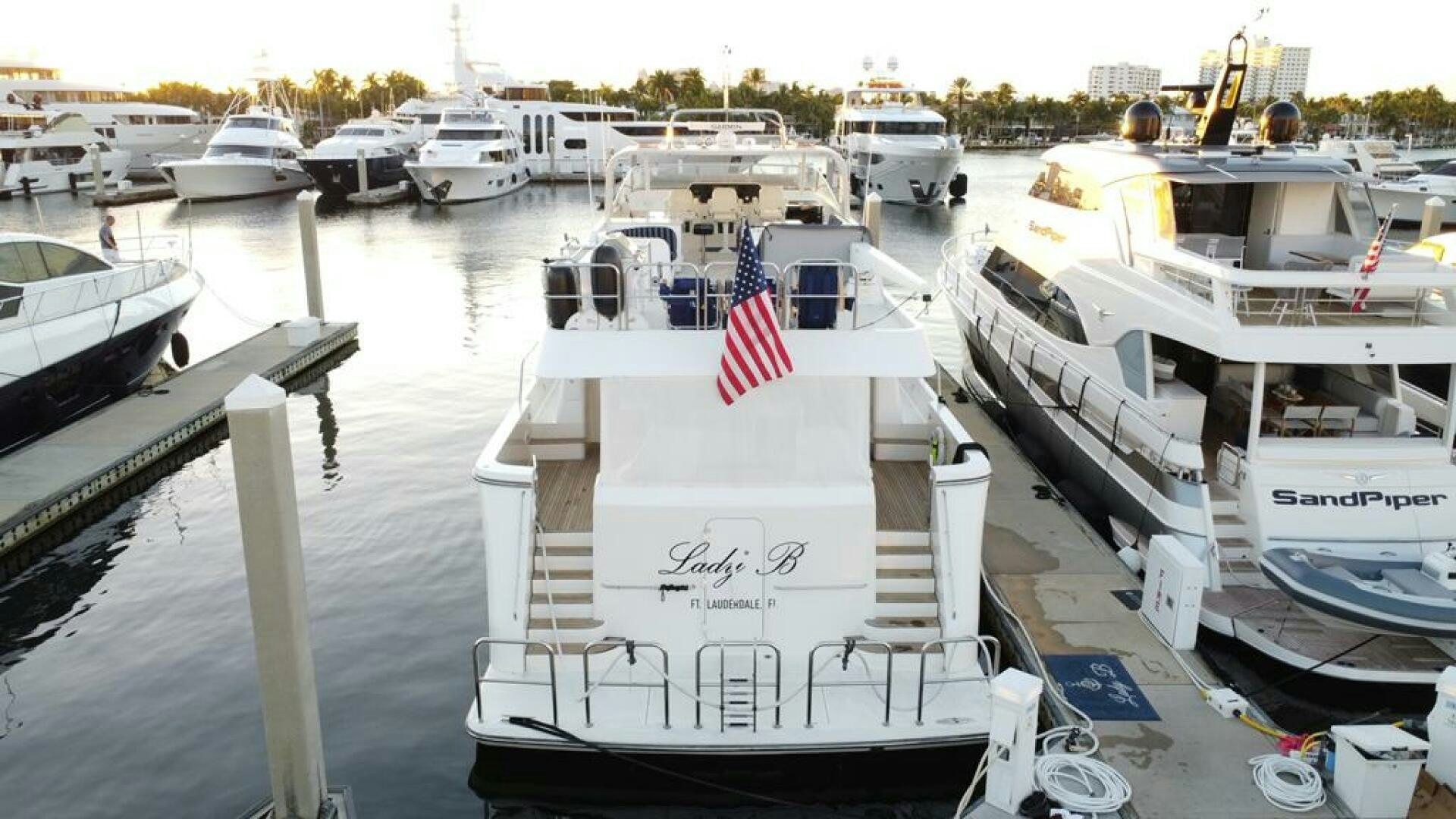 a boat docked at a pier aboard LADY B Yacht for Sale