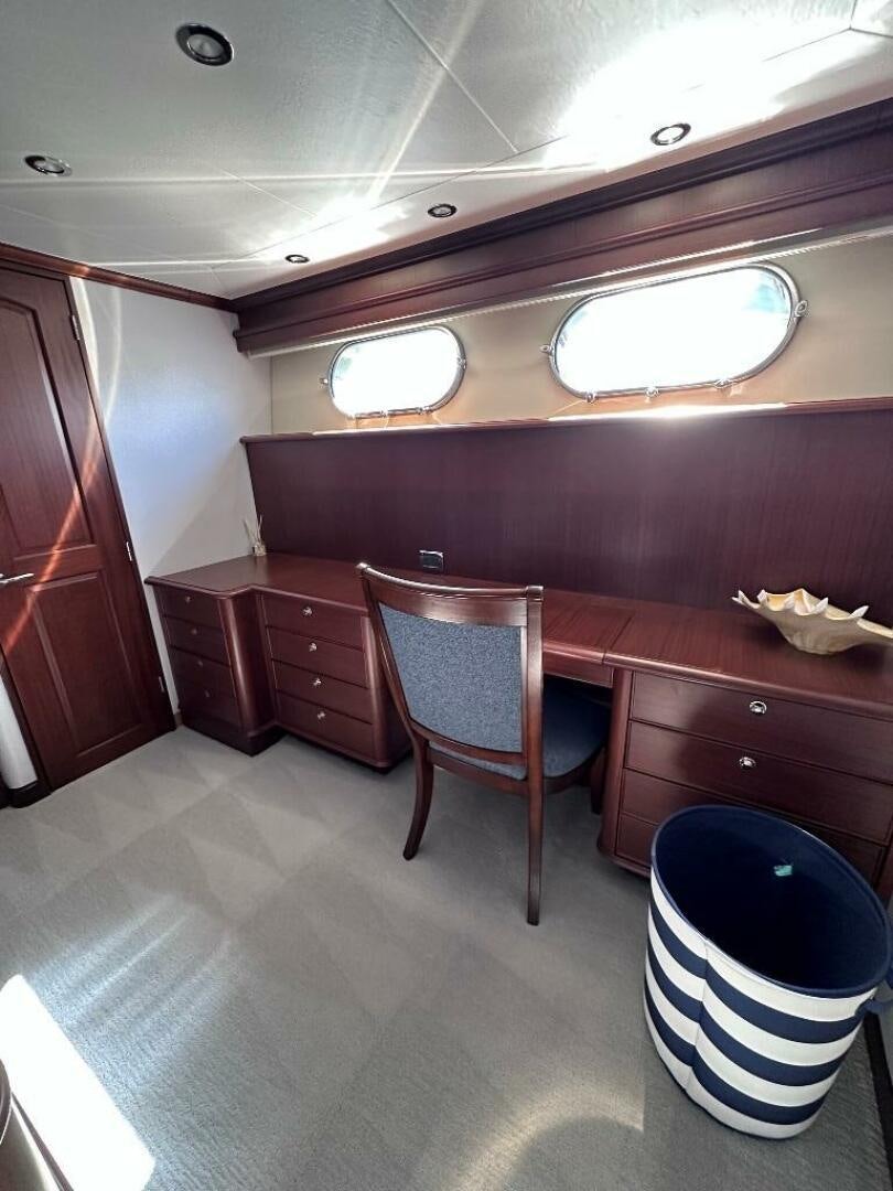 a room with a desk and a chair aboard LADY B Yacht for Sale