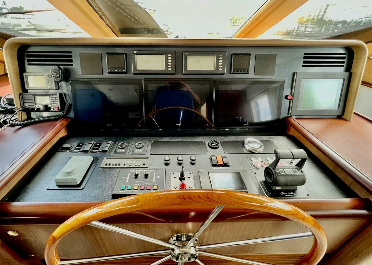 a person in a helmet sitting in a cockpit of an airplane aboard LADY B Yacht for Sale