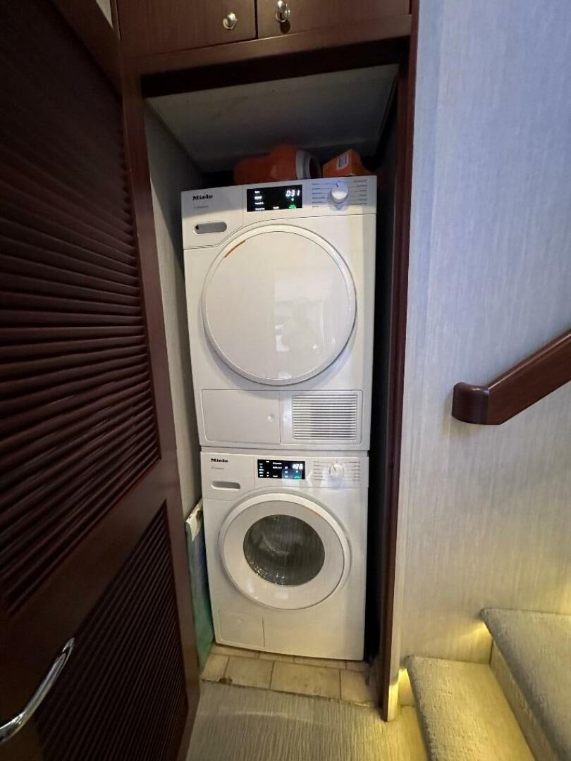 a washing machine in a room aboard LADY B Yacht for Sale