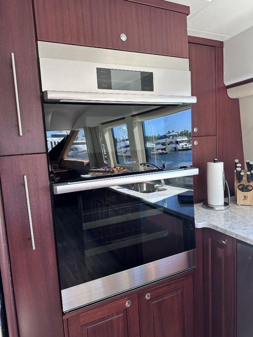 a kitchen with a large window aboard LADY B Yacht for Sale