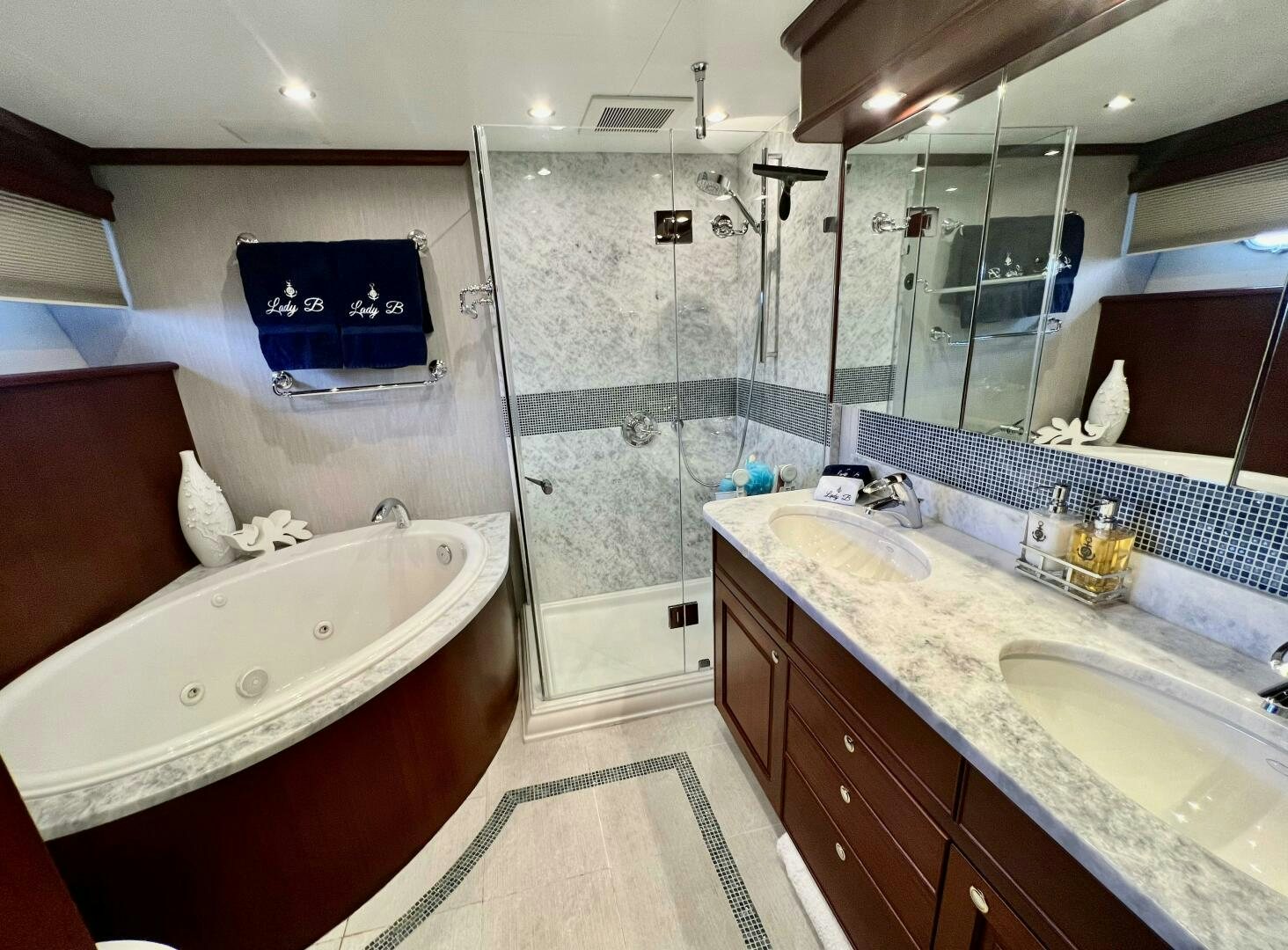 a bathroom with a tub sink and a shower unit aboard LADY B Yacht for Sale
