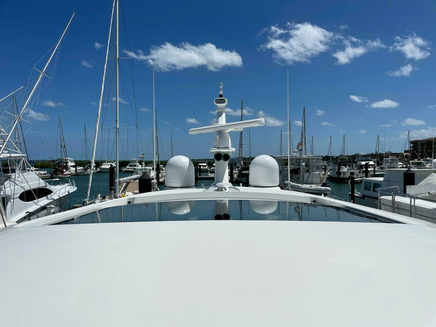 a white boat with a satellite dish on top aboard WHIRL AWAY Yacht for Sale