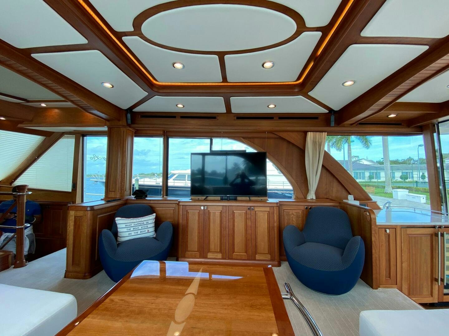 a room with a table chairs and a large window aboard WHIRL AWAY Yacht for Sale