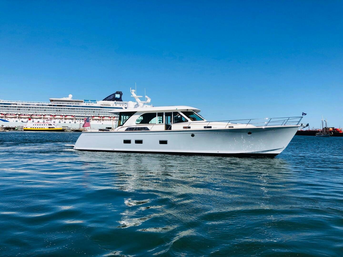 a white boat in the water aboard WHIRL AWAY Yacht for Sale