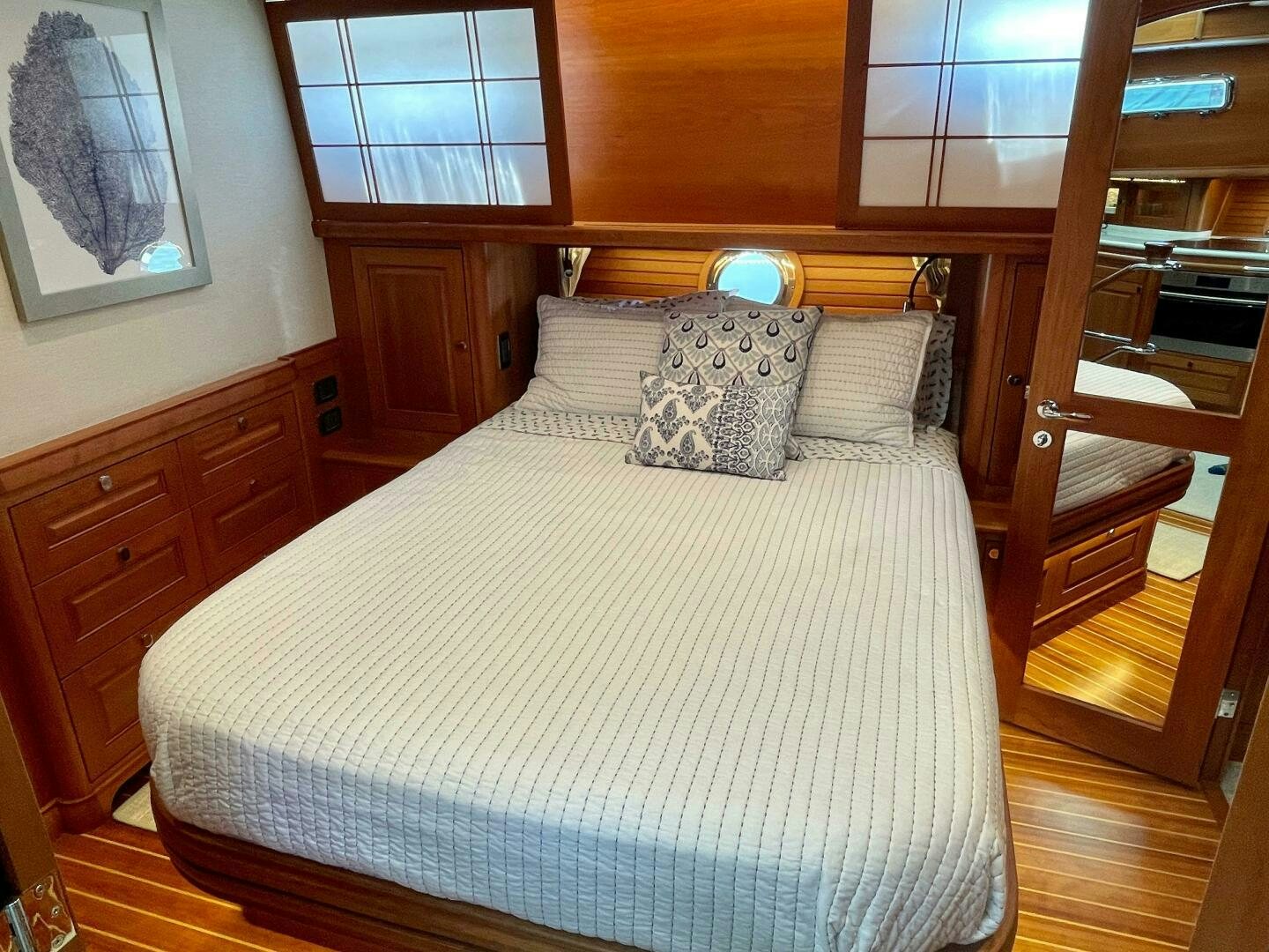 a bed with a white comforter aboard WHIRL AWAY Yacht for Sale