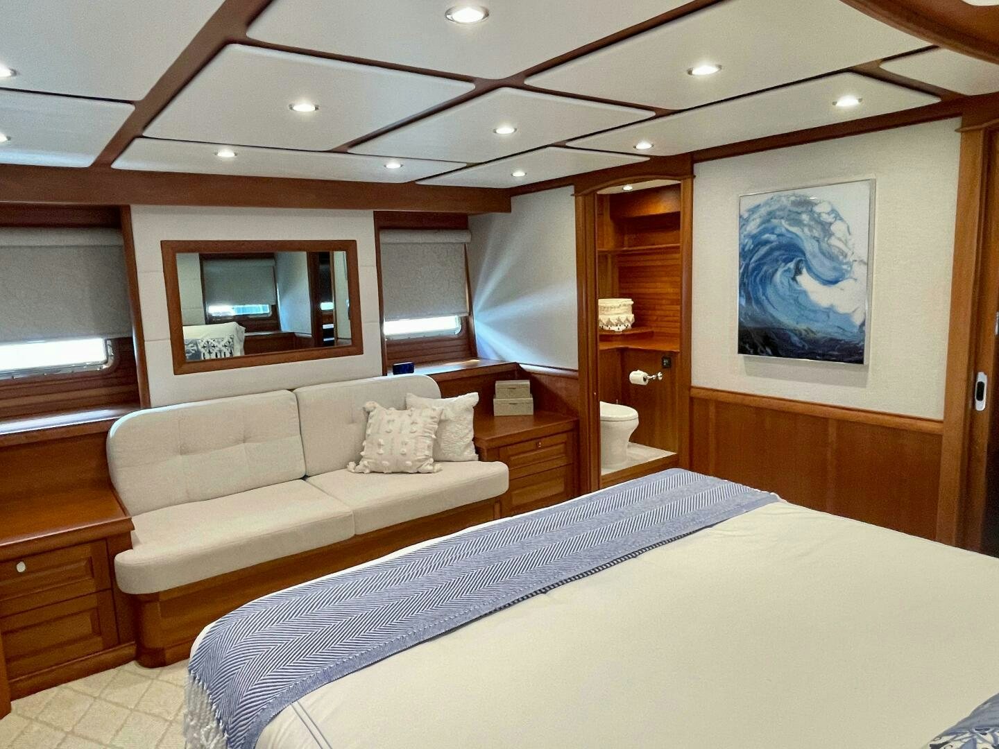 a bedroom with a bed and a television aboard WHIRL AWAY Yacht for Sale