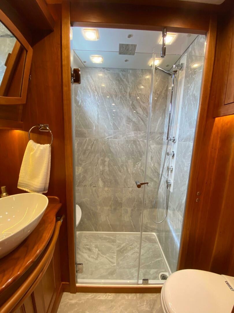 a bathroom with a glass shower aboard WHIRL AWAY Yacht for Sale