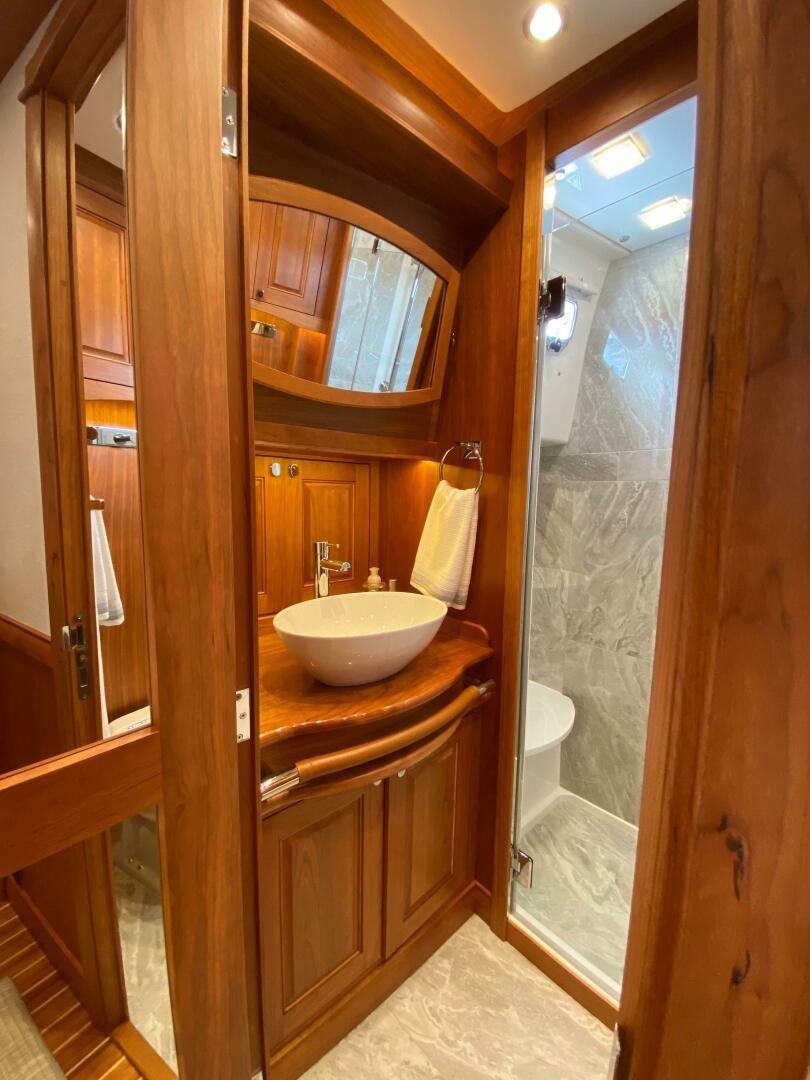 a bathroom with a sink and a shower aboard WHIRL AWAY Yacht for Sale