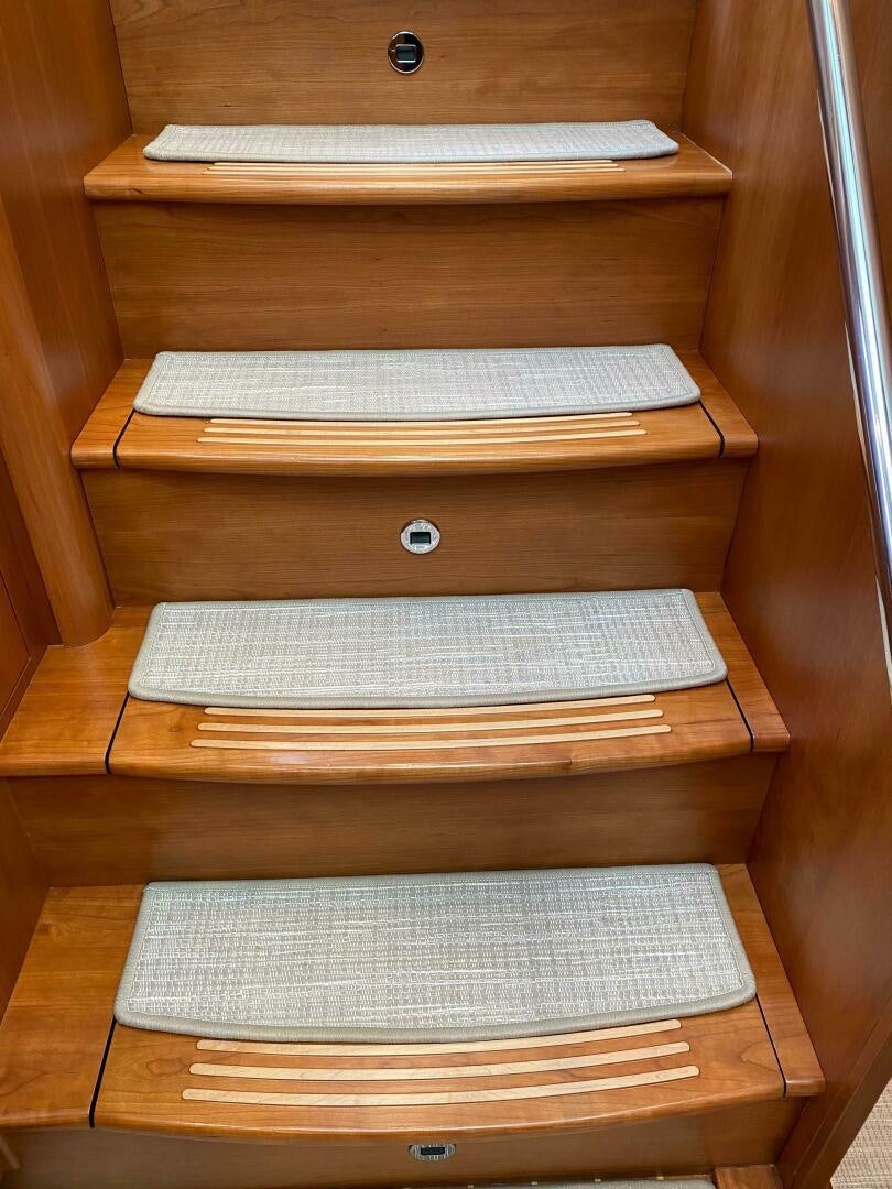 a stack of books on a wooden shelf aboard WHIRL AWAY Yacht for Sale