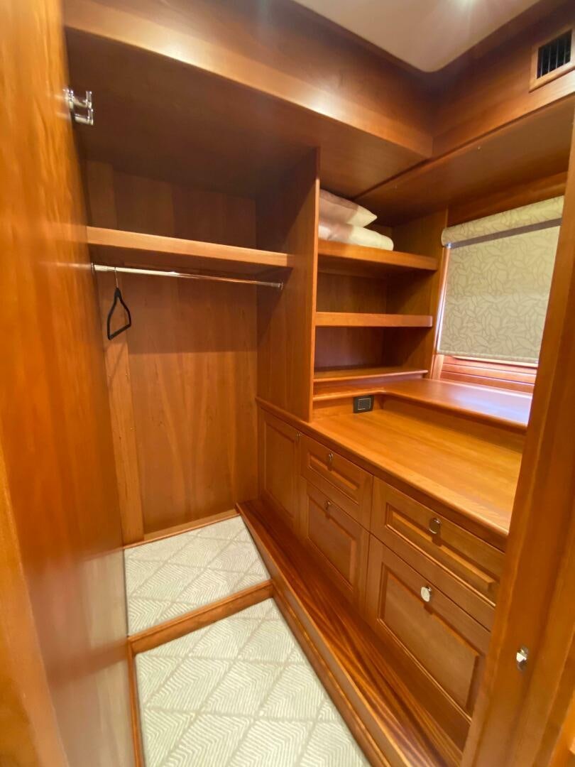 a wooden room with a wood cabinet aboard WHIRL AWAY Yacht for Sale