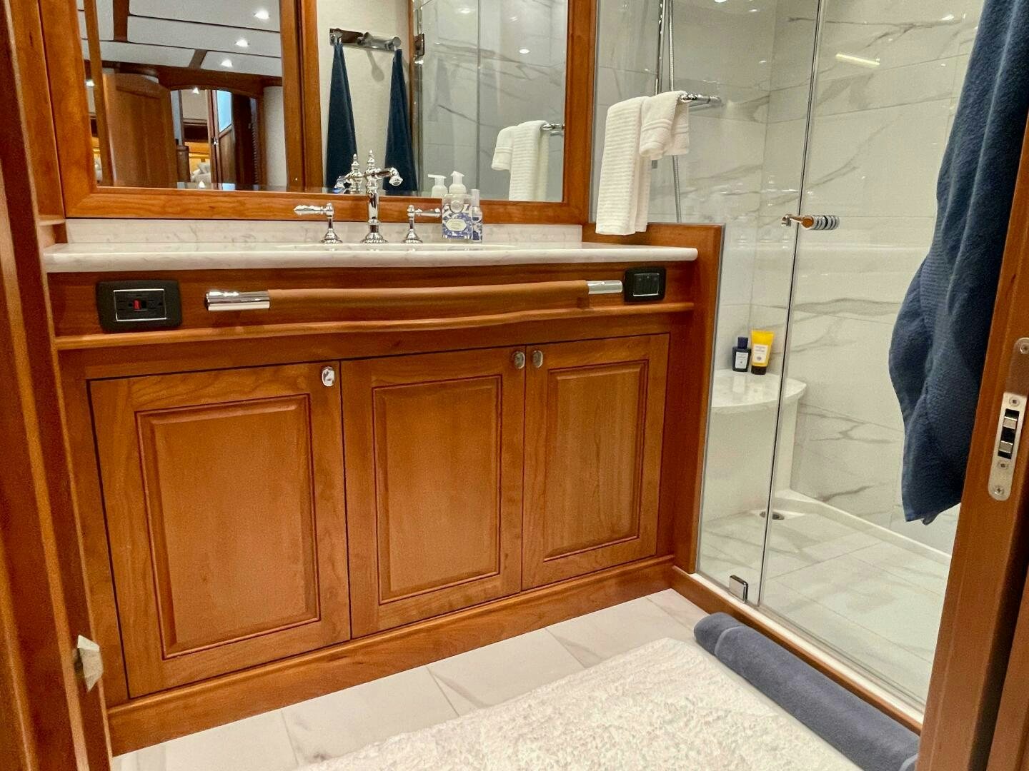a bathroom with a glass shower aboard WHIRL AWAY Yacht for Sale