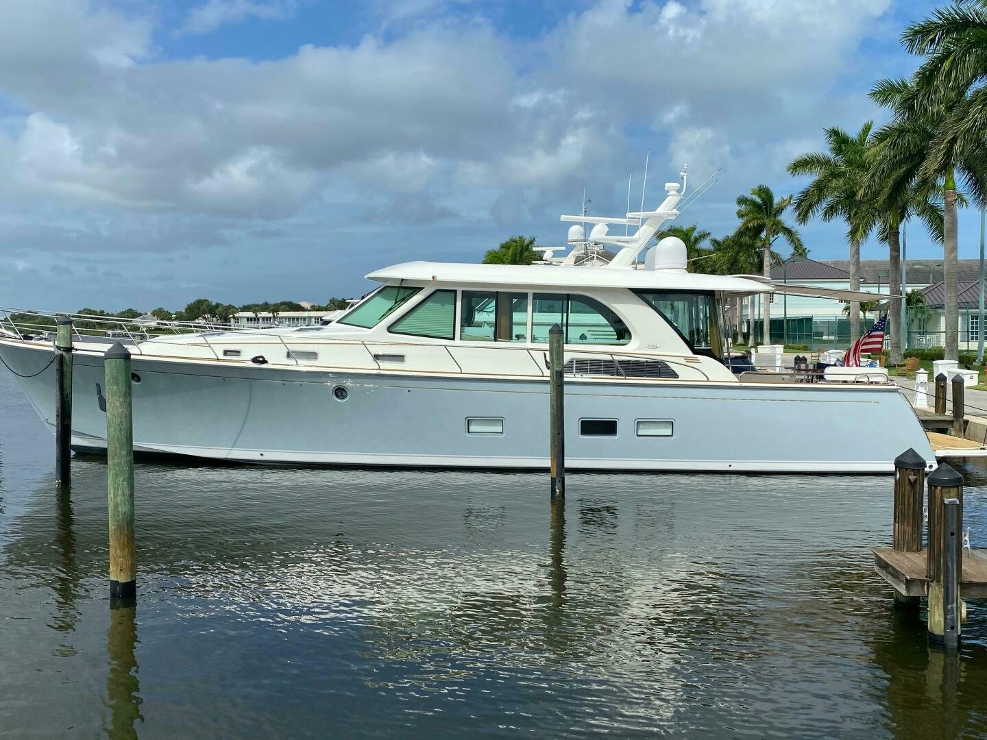 a white boat in a body of water aboard WHIRL AWAY Yacht for Sale