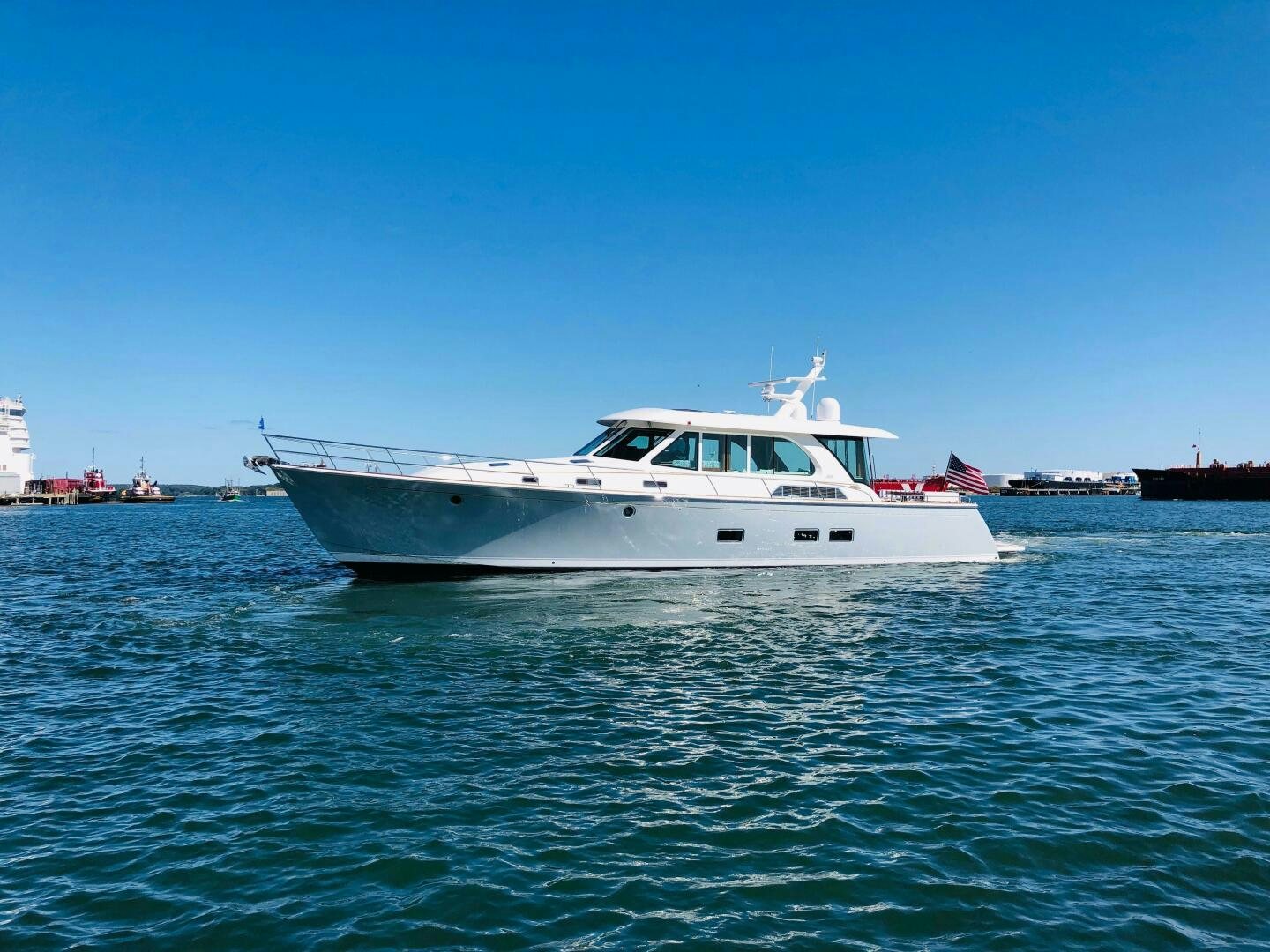 a white boat on the water aboard WHIRL AWAY Yacht for Sale