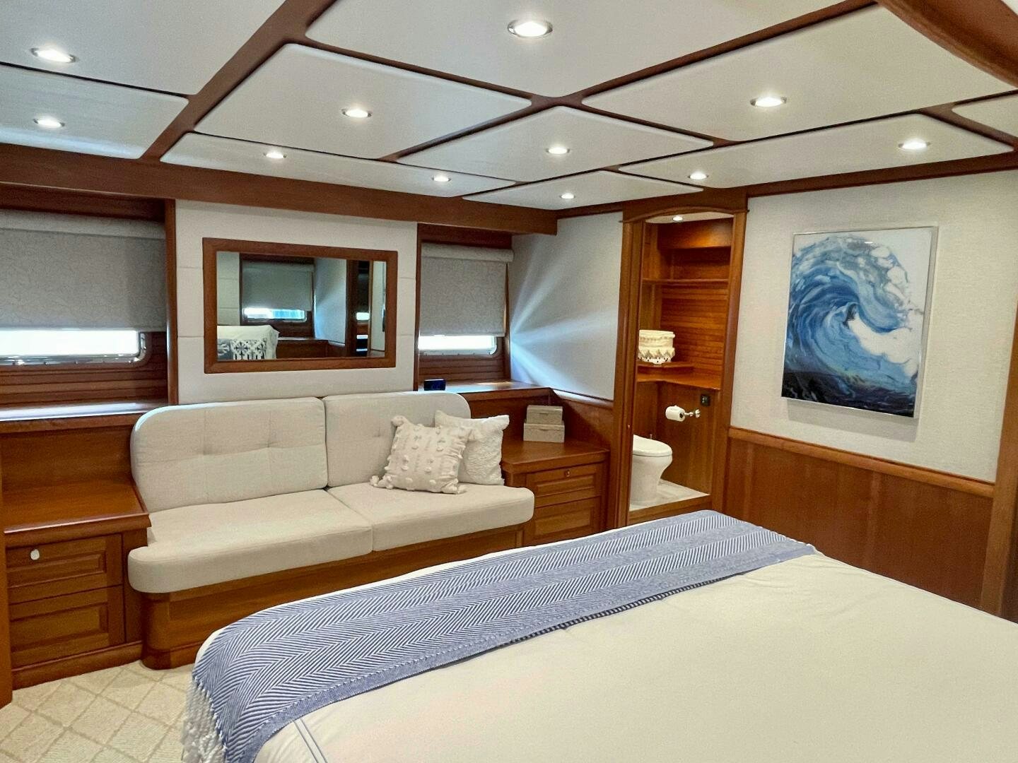 a bedroom with a bed and a television aboard WHIRL AWAY Yacht for Sale
