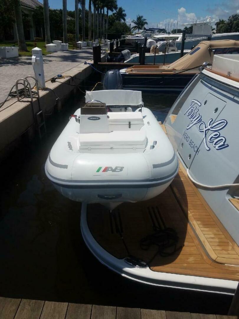a white boat on a dock aboard WHIRL AWAY Yacht for Sale