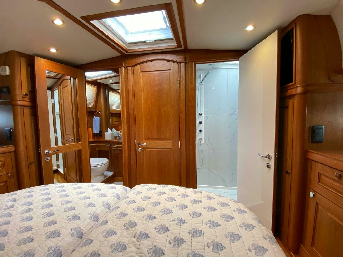 a bedroom with a bed and closet aboard WHIRL AWAY Yacht for Sale