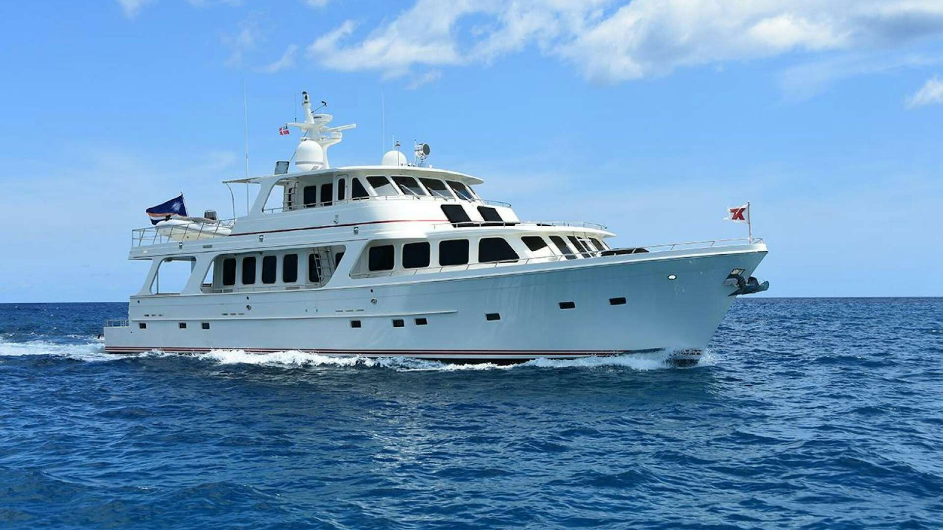 a white boat on the water aboard LUCKY LADY Yacht for Sale