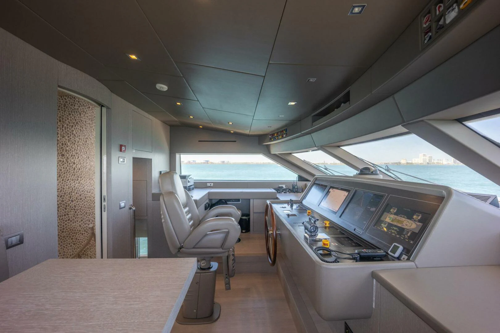 a room with a table and chairs aboard PHOENIX Yacht for Sale