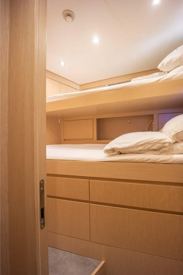 a closet with a bed aboard PHOENIX Yacht for Sale