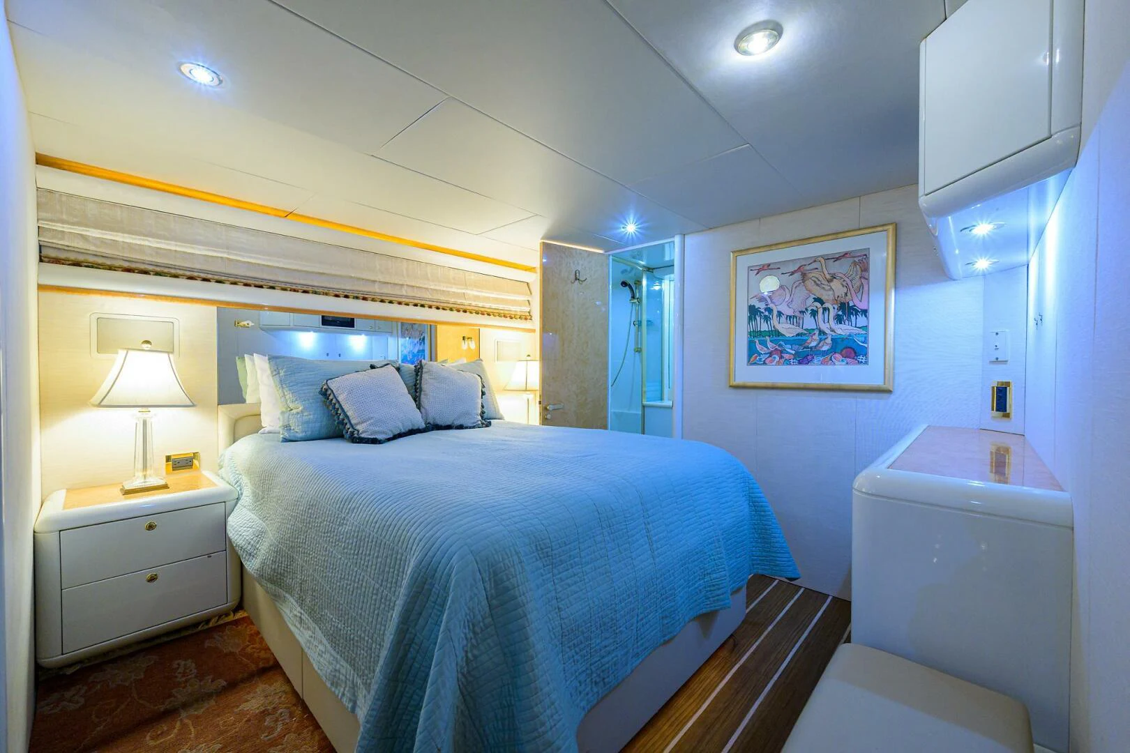 a bedroom with a bed and a desk aboard LOST TEXAN Yacht for Sale