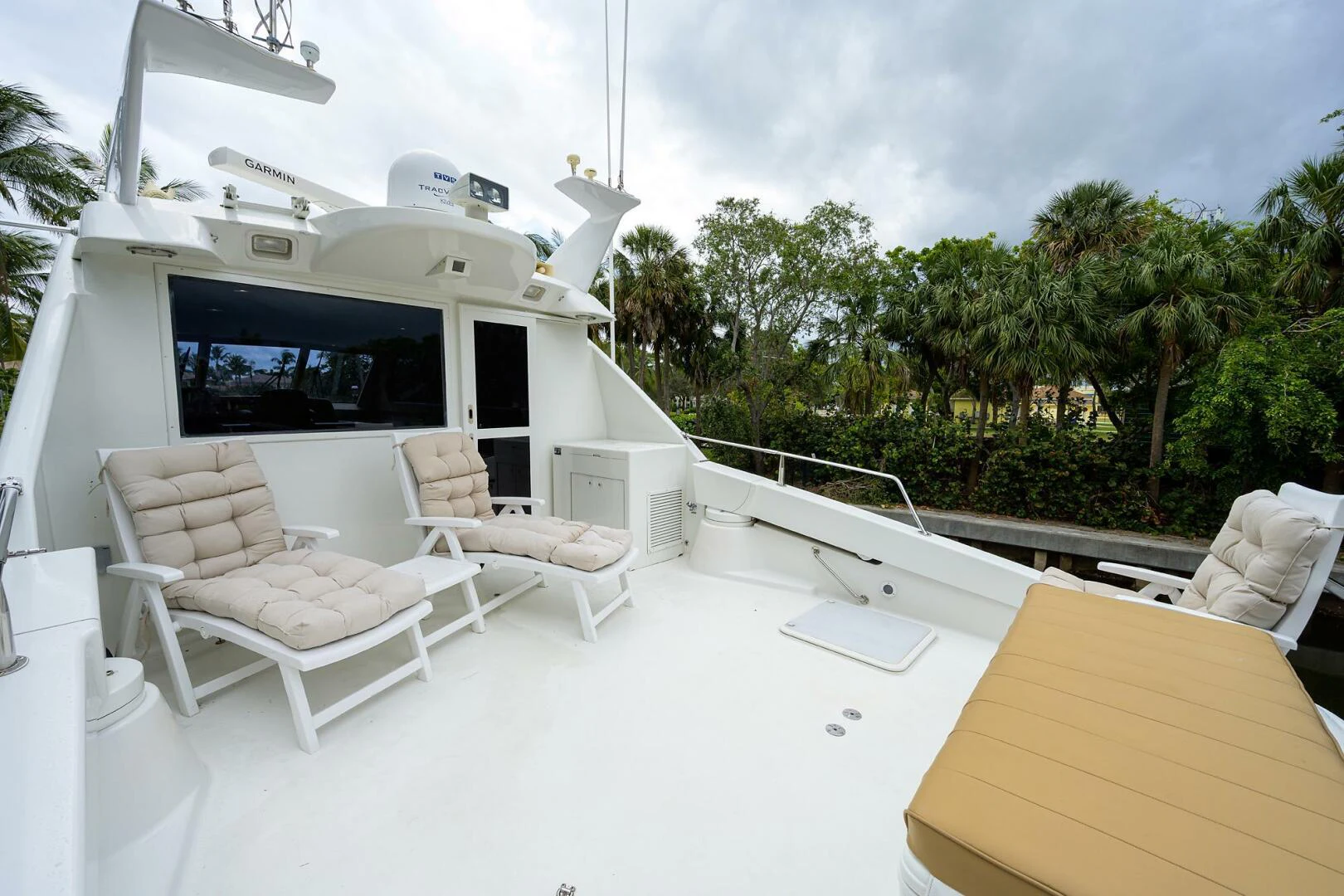 a room with a bed and a table and chairs aboard LOST TEXAN Yacht for Sale