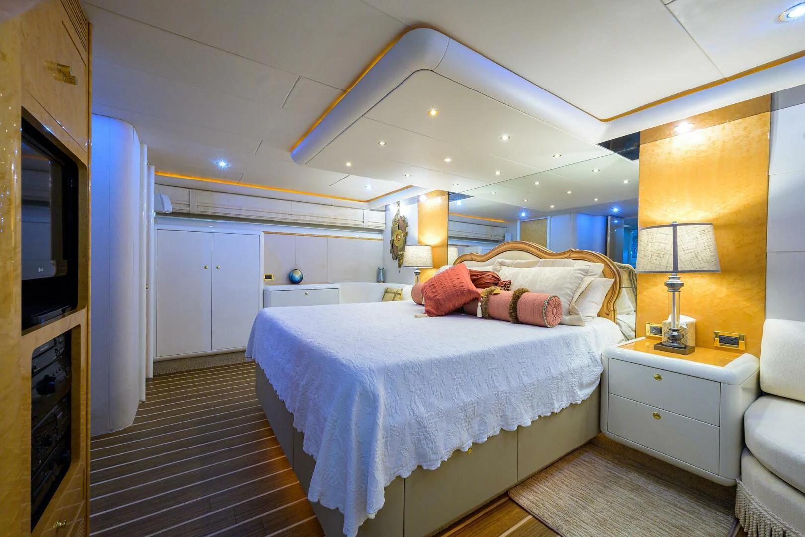 a bedroom with a bed and a television aboard LOST TEXAN Yacht for Sale