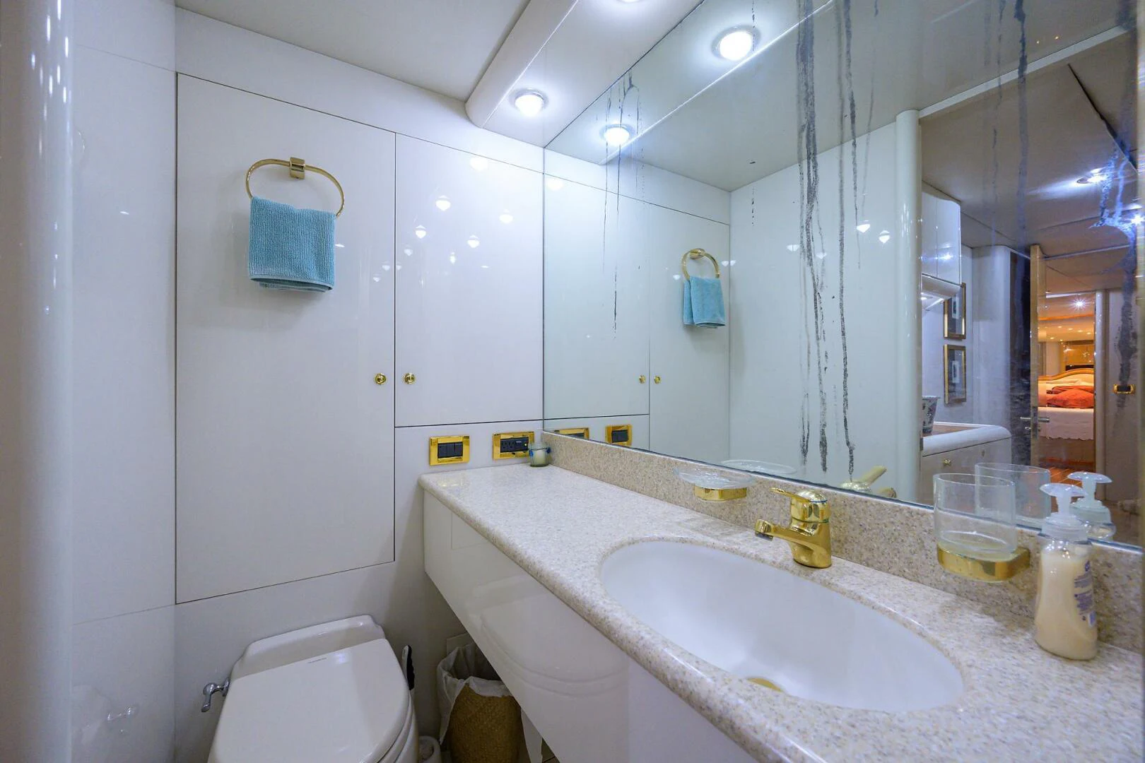 a bathroom with a sink and a mirror aboard LOST TEXAN Yacht for Sale