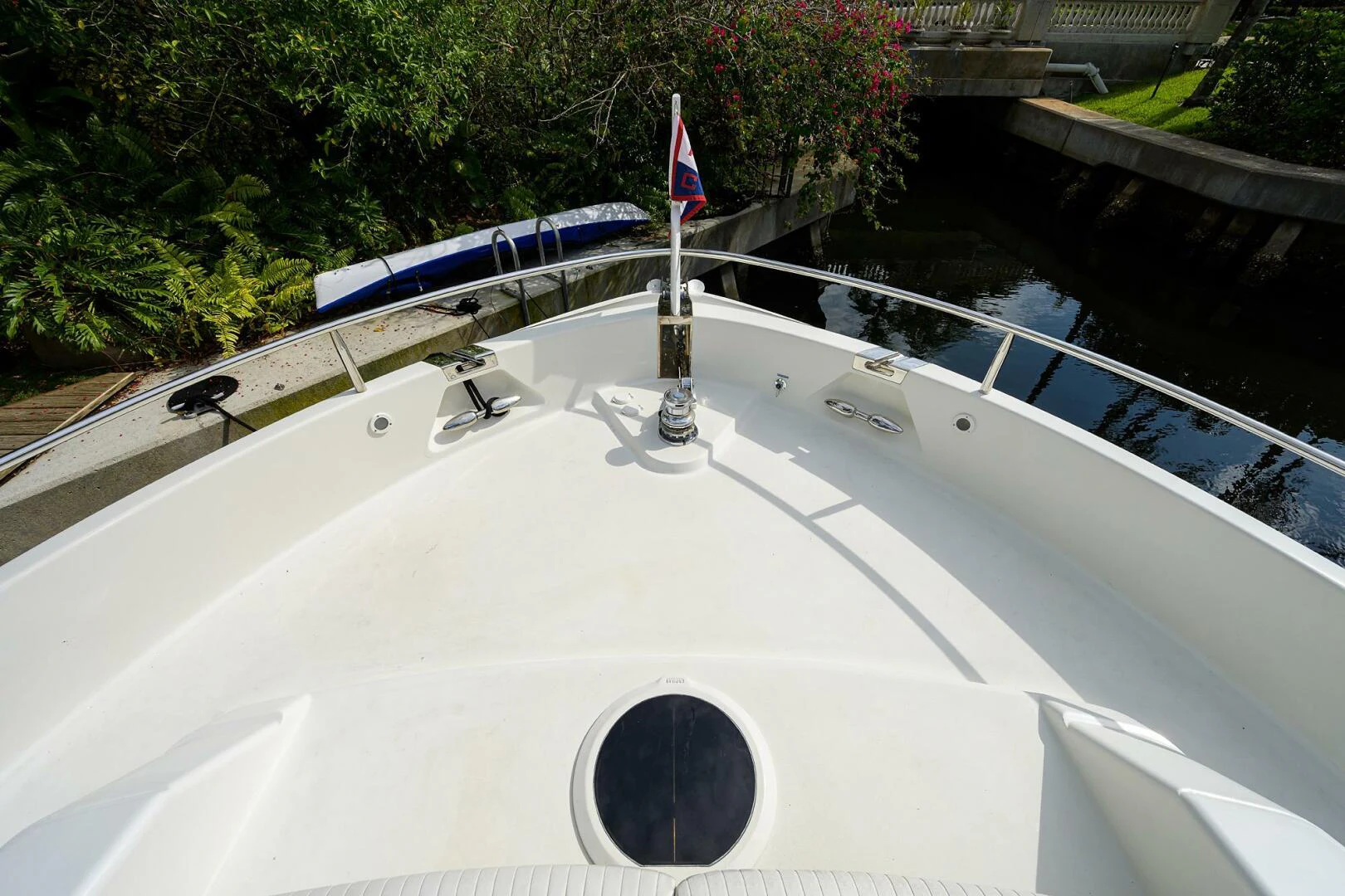 a pool with a bridge and a building in the background aboard LOST TEXAN Yacht for Sale