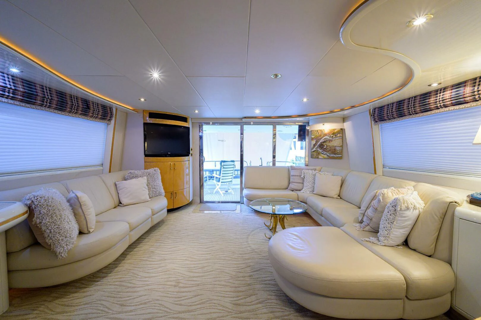 a living room with a large window aboard LOST TEXAN Yacht for Sale
