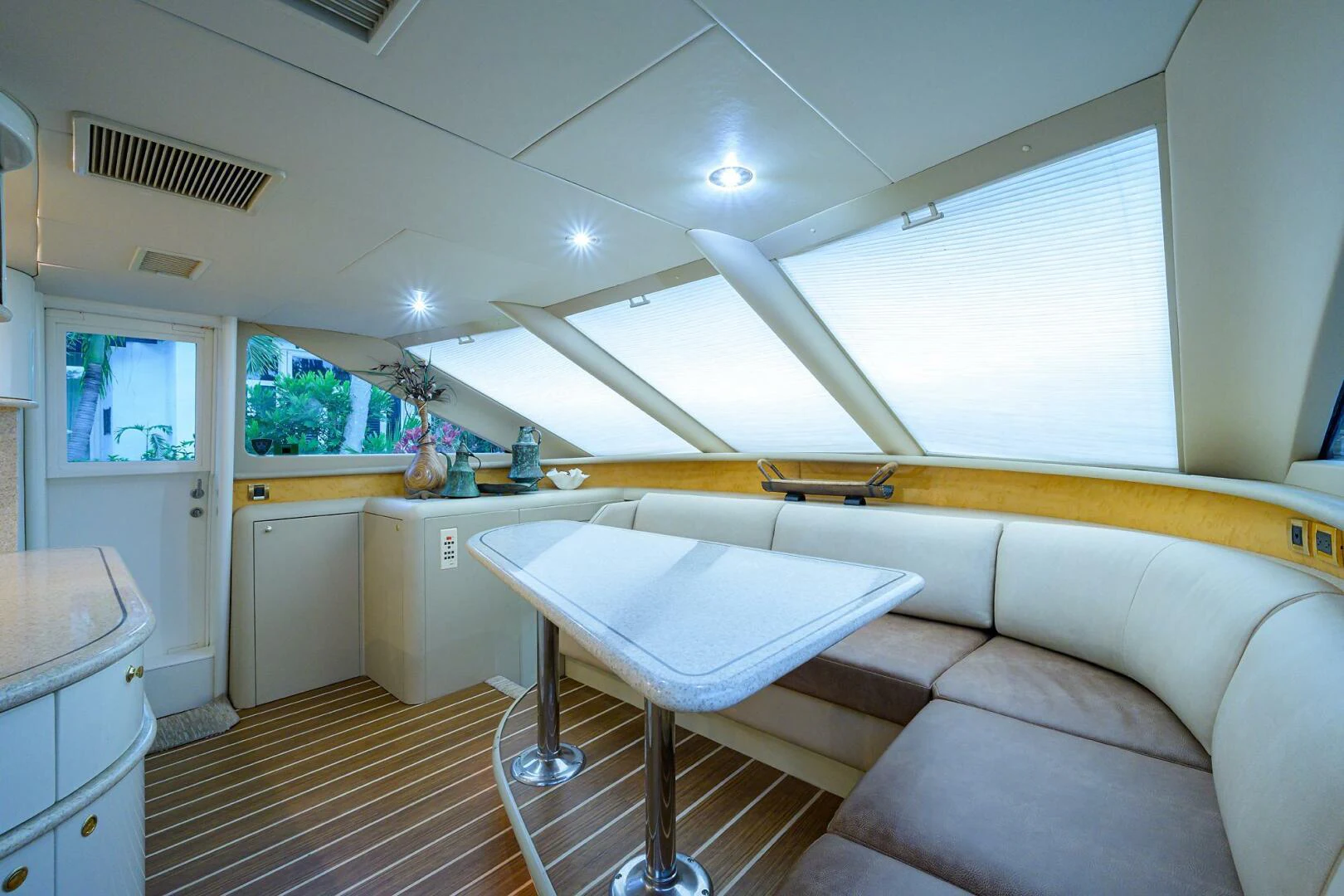 a kitchen with a table and a couch aboard LOST TEXAN Yacht for Sale
