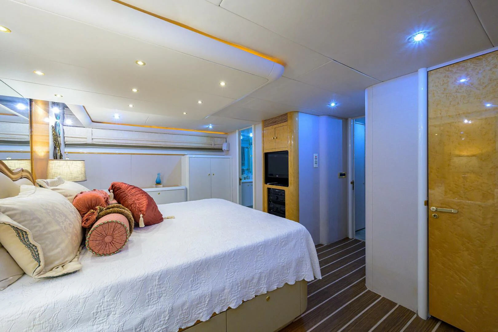 a bedroom with a bed and a door aboard LOST TEXAN Yacht for Sale