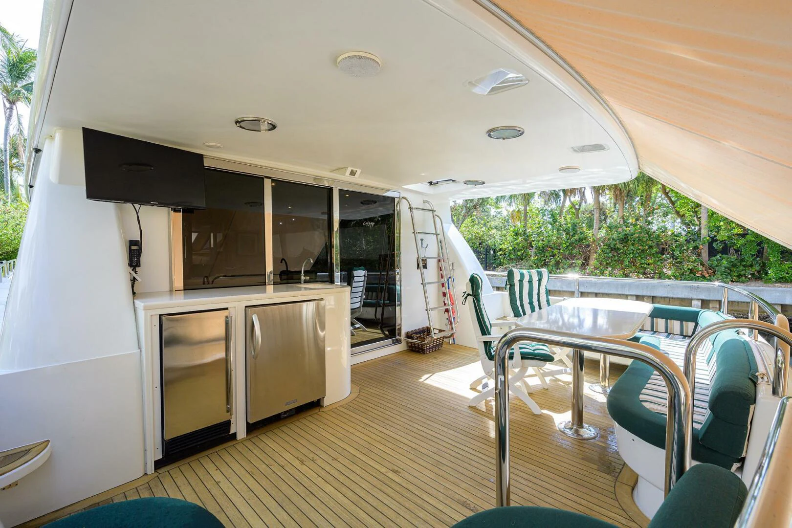 a large open house with a large deck and a pool aboard LOST TEXAN Yacht for Sale