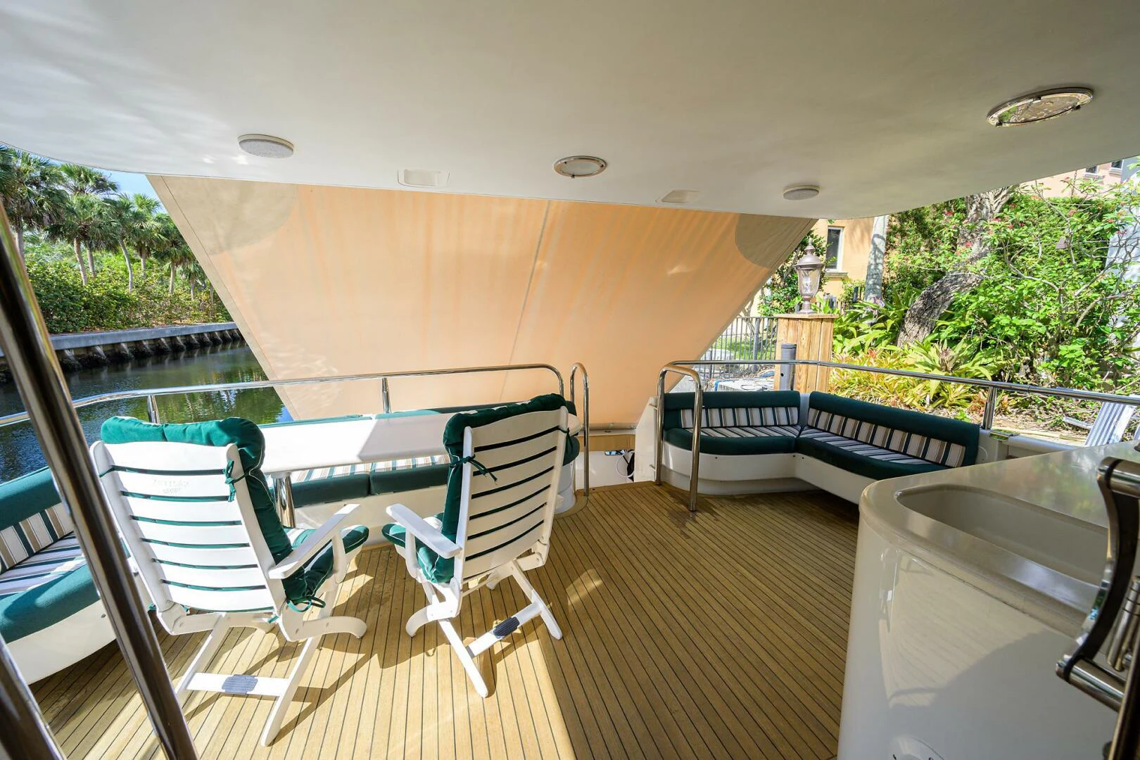 a deck with chairs and a pool aboard LOST TEXAN Yacht for Sale