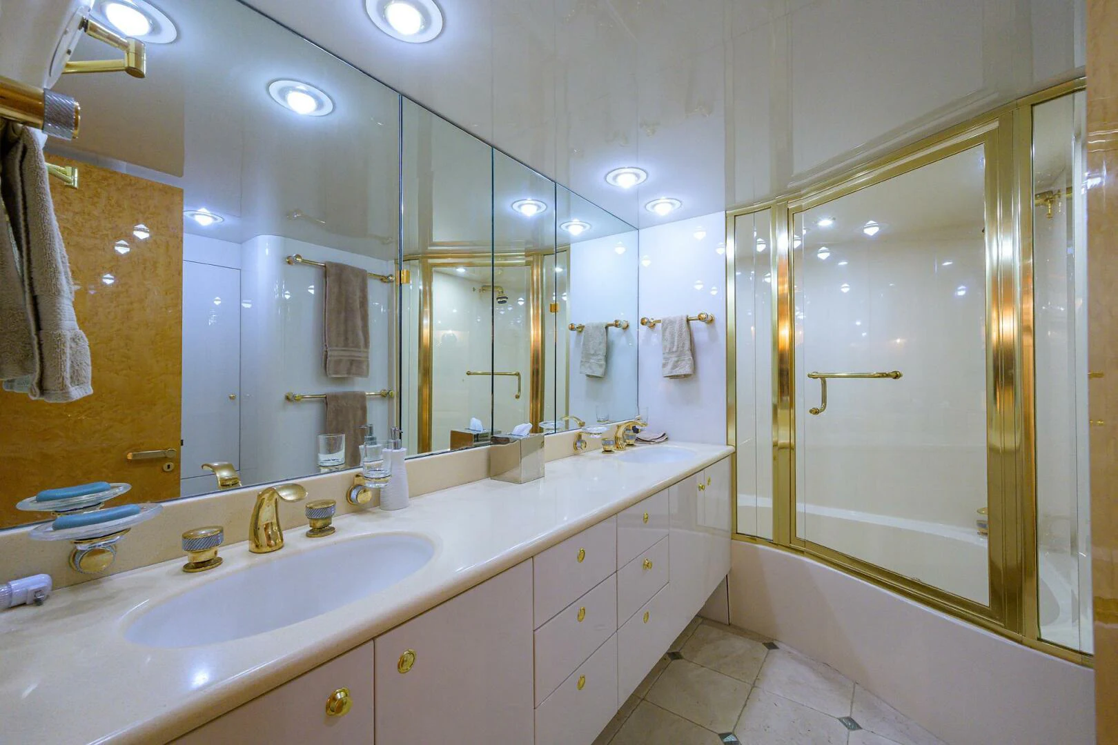 a bathroom with a large mirror aboard LOST TEXAN Yacht for Sale
